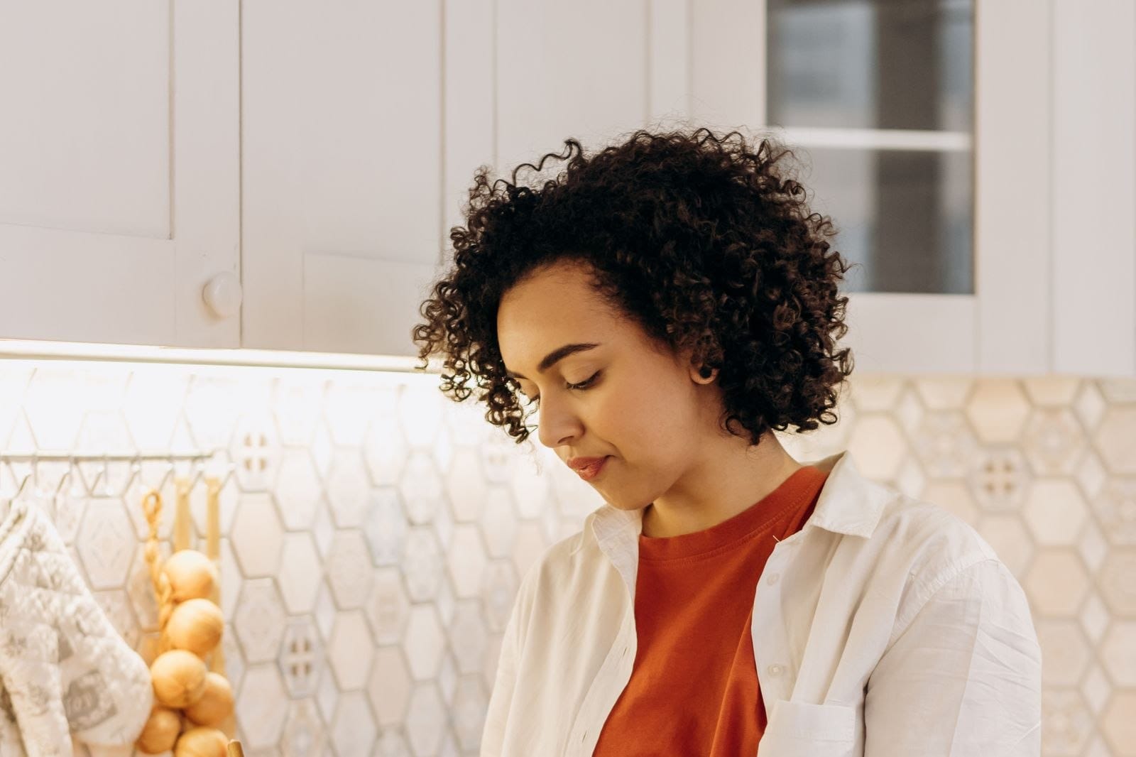 Woman preparing balanced meals in her kitchen
